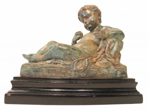 A Bronze Figure of a Reclining Cupid