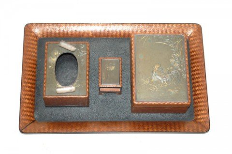 A Japanese Mixed Metal and Lacquered Wood Smoking Set