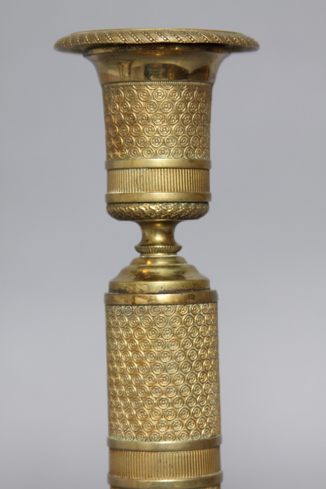 A Pair of French Empire Gilt Bronze Candle Sticks