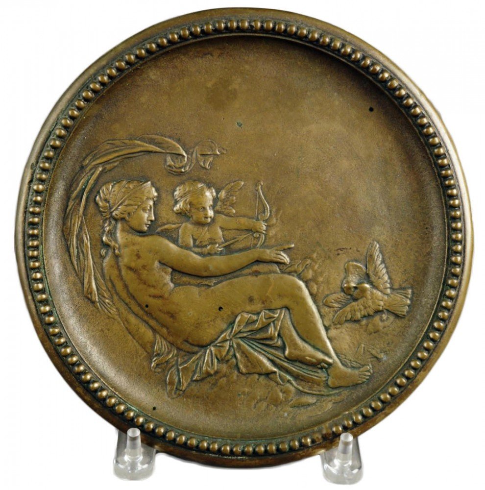 A Cast Brass Plaque depicting Venus and Cupid