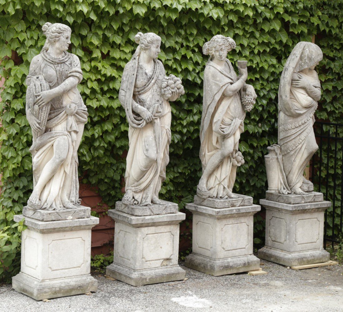 An impressive monumental group of four French handcarved limestone garden figures depicting the seasons