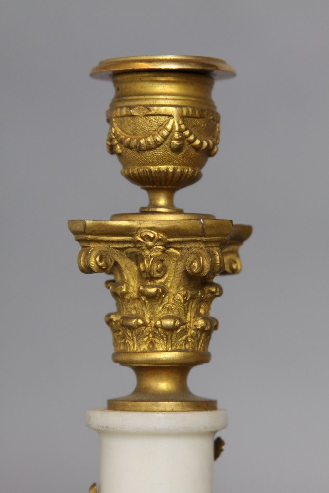 A Pair of French Gilt Bronze and Marble Candlesticks