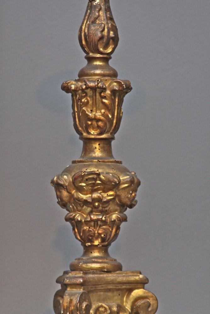 A Pair of Venetian Baroque Carved and Gilded Pricket Sticks