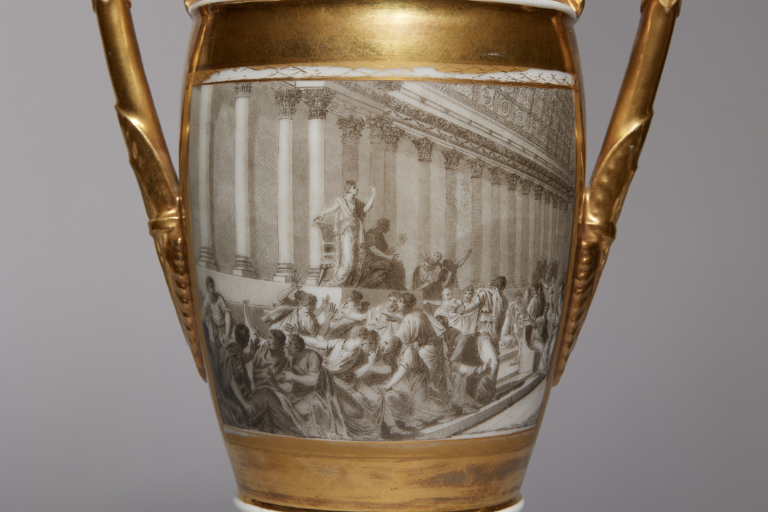 Pair of French Porcelain de Paris Gold Urns with Scenes of Roman History