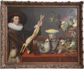 A Game Still Life with a Young Man Holding a Hare in front of a Table with other Victuals,Dutch, 1st half 17thc. by Monogrammist DV