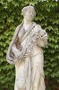 An impressive monumental group of four French handcarved limestone garden figures depicting the seasons